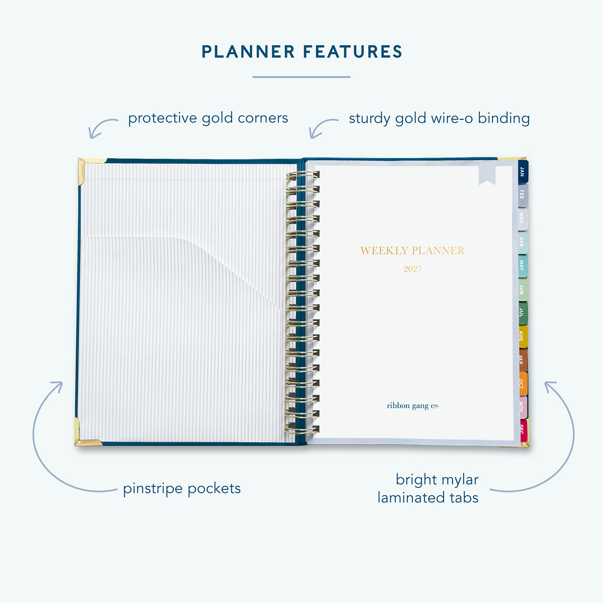 A classic navy spiral bound 2027 planner on a white background open to the first page showing a pocket inside the front cover and a title page.